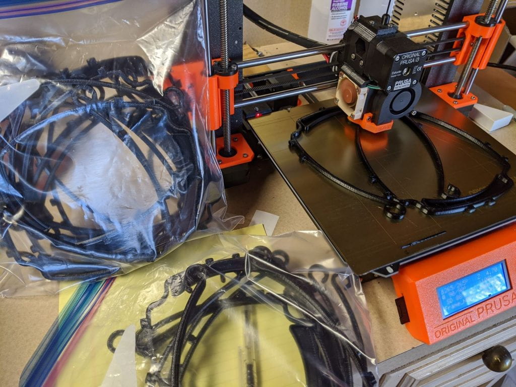 A picture of a 3d printer and printing materials.